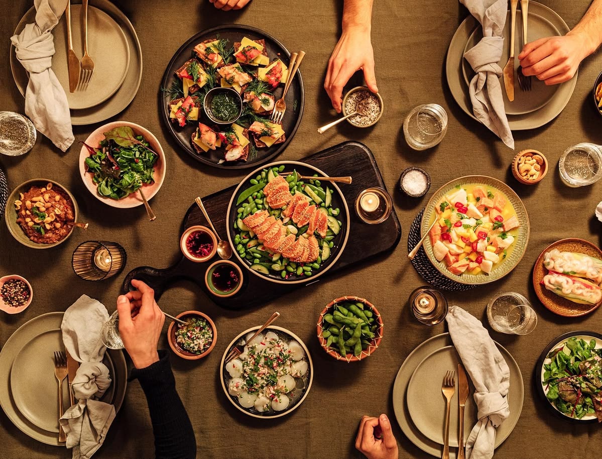 The Recovervivoclean team gathered around a table with seasonal produce in Queenstown